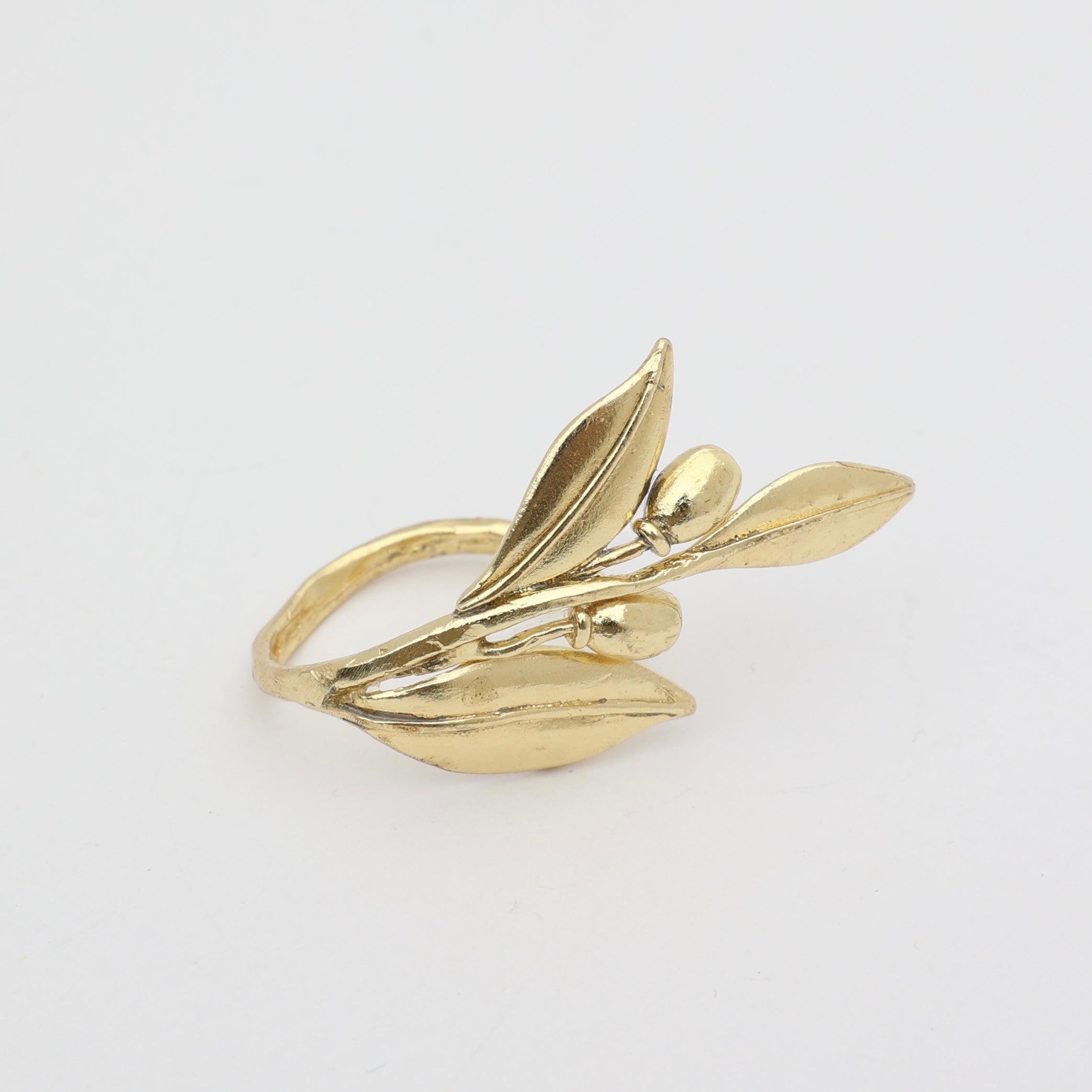 Handmade brass nature-inspired statement ring with sculpted leaf and berry details, artisan jewelry made in Greece