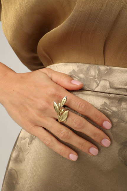 Handmade brass sculptural statement ring with leaf and fruit motifs