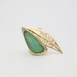 Handmade brass bold cocktail ring with raw resin stone set in textured leaf motif
