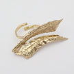 Nerra Ring top view — handmade brass sculptural ring with overlapping textured blades