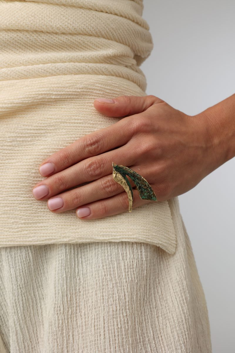 Nerra Ring close-up — handmade brass statement ring with organic blade motif and raw edges