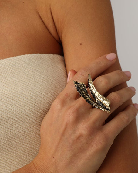 Nerra Ring detail — handmade brass artisan ring with deeply textured metal blades
