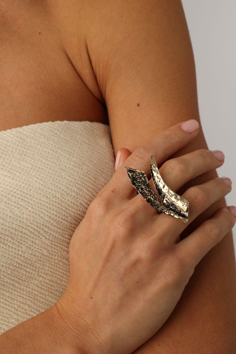 Nerra Ring detail — handmade brass artisan ring with deeply textured metal blades