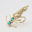 Draco Ring side view — handmade brass statement ring with fin detail and faceted crystal accent