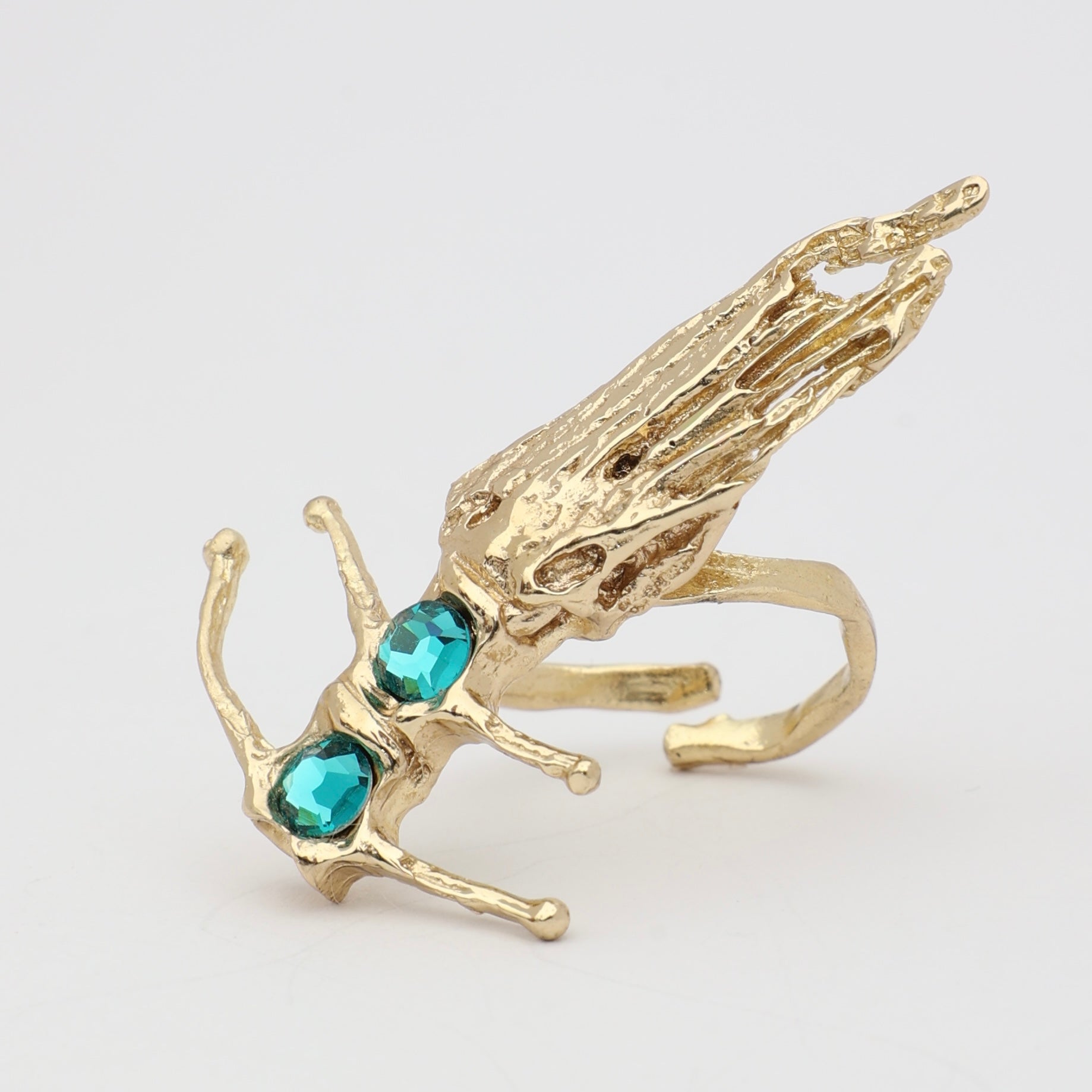 Draco Ring side view — handmade brass statement ring with fin detail and faceted crystal accent
