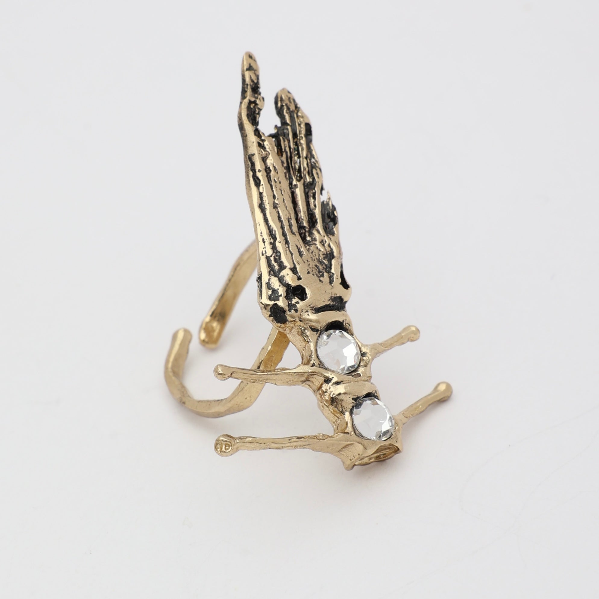 Draco Ring — handmade brass sculptural dragonfish ring with crystal stones on white background