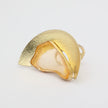 Pond Ring — handmade brass statement ring with half-moon shield and raw resin stone on white background
