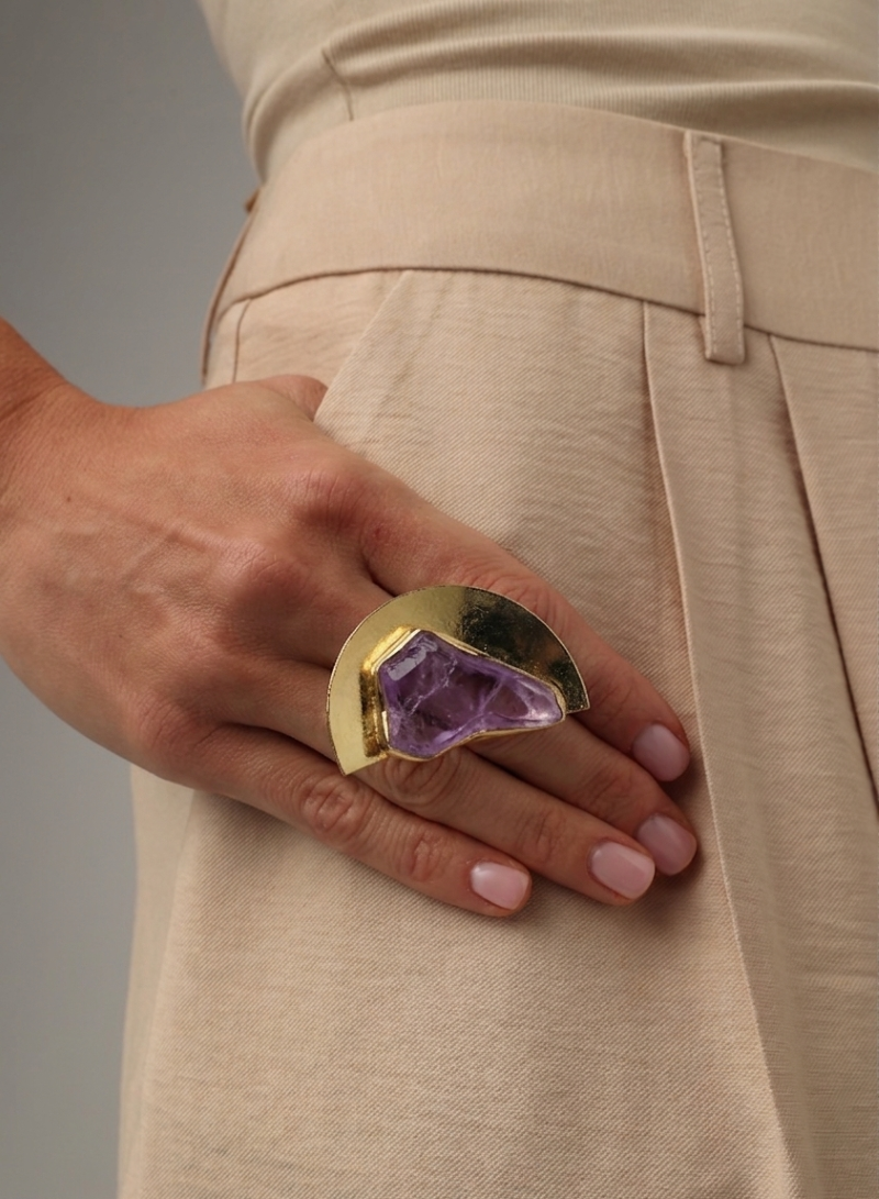 Pond Ring flat lay — handmade brass geometric ring with half-circle silhouette and resin stone accent
