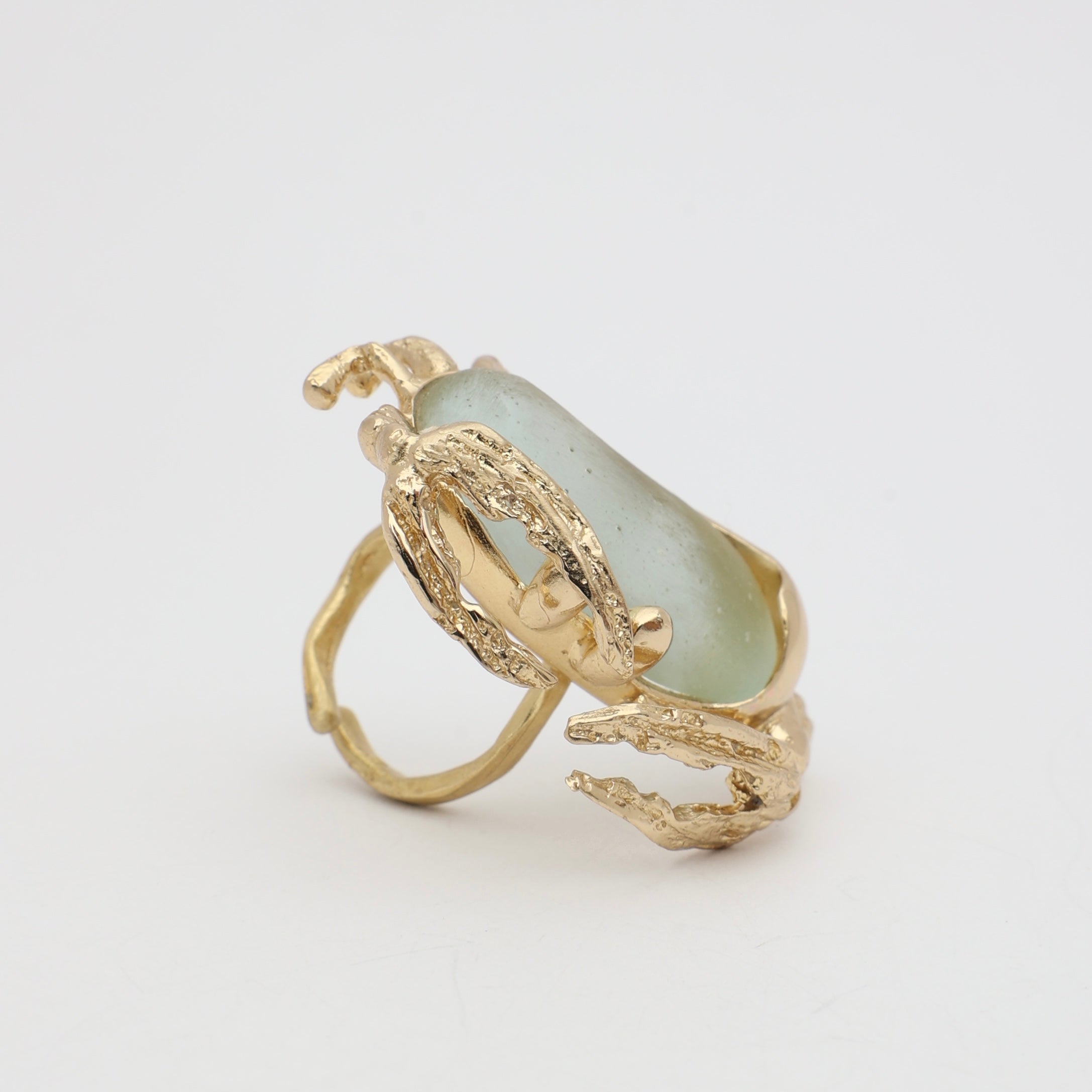 Crabby Ring detail — handmade brass ring with open adjustable band and textured creature legs