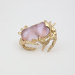 Crabby Ring close-up — handmade brass ring with detailed crab claw prongs gripping oversized resin stone