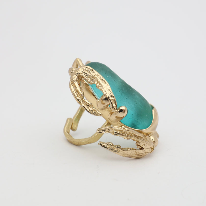 Crabby Ring side view — handmade brass sculptural ring with textured claw legs and large oblong resin stone