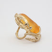 Crabby Ring — handmade brass statement ring shaped like a crab with resin stone body on white background