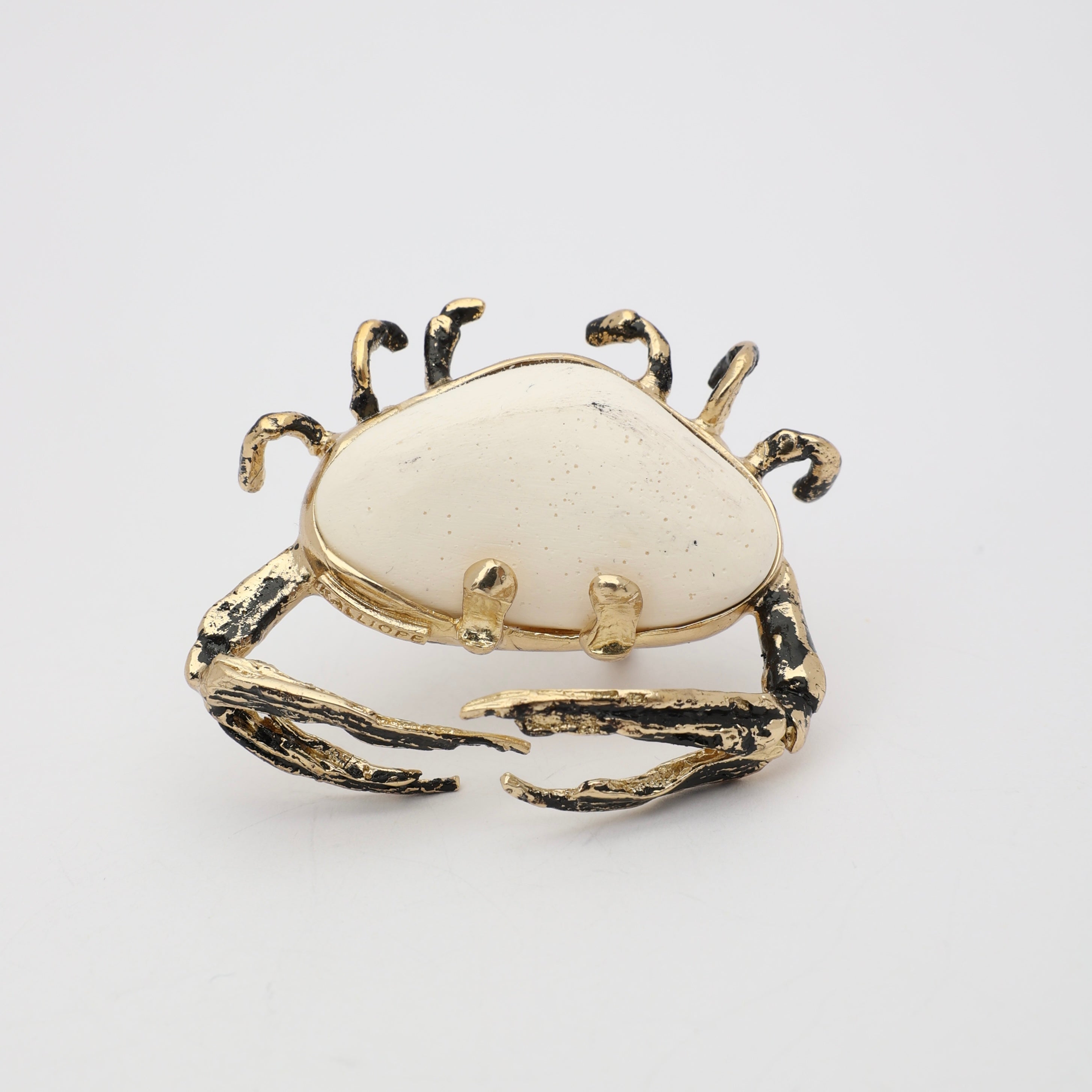 Claw Crabby Ring front view — handmade brass sculptural ring with eight crab legs and wide resin stone body