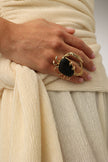 Claw Crabby Ring close-up — handmade brass crab ring with two baguette crystals and large domed resin stone shell