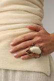 Claw Crabby Ring on model — handmade brass statement ring worn on finger showing full crab spread and scale