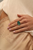 Delphi Ring — handmade brass enamel signet ring with swallow motif, worn on model
