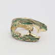 Claw Ring — handmade brass statement ring with wide wraparound textured body and verdigris detail on white background