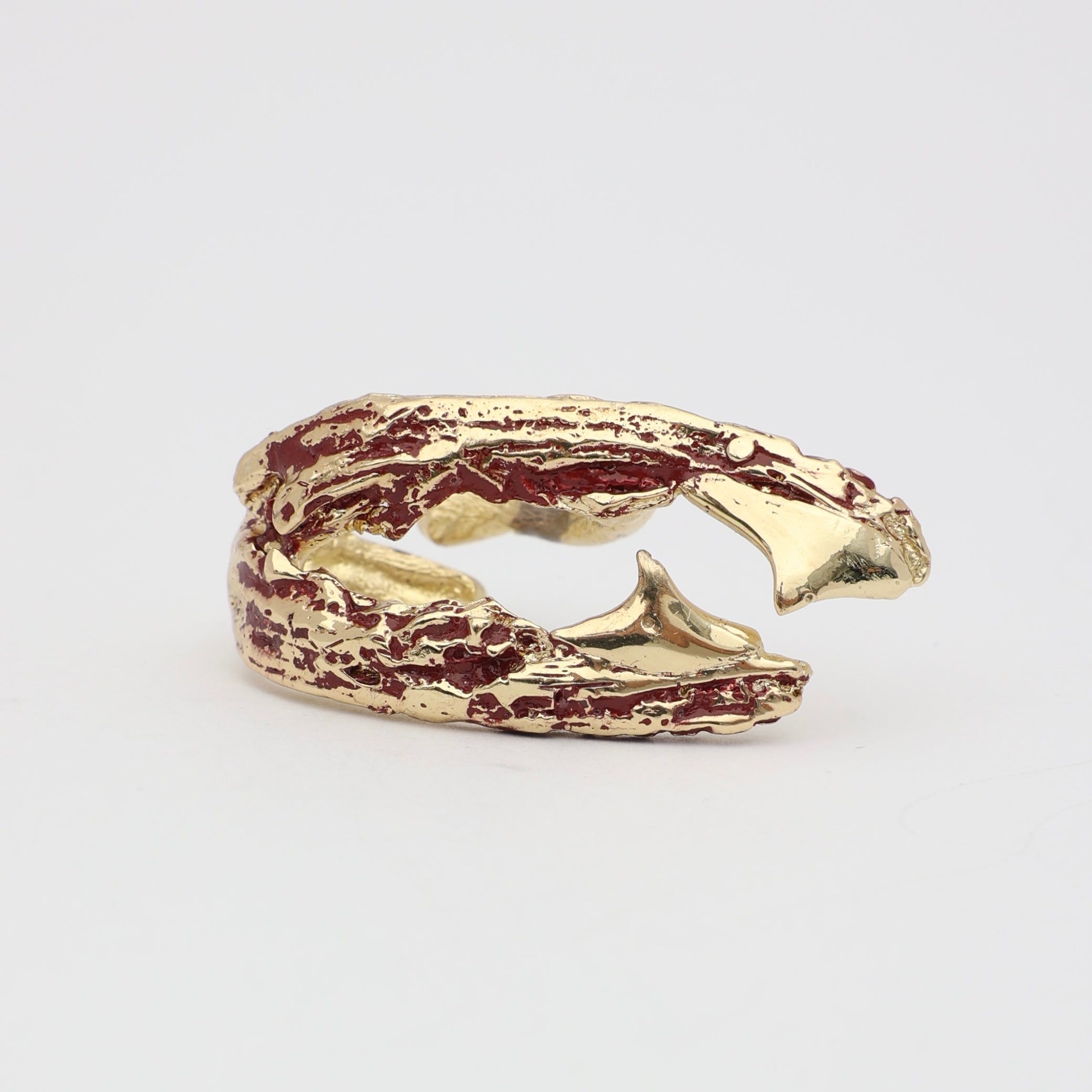 Claw Ring flat lay — handmade brass wide band ring with verdigris detail and rugged sculptural surface