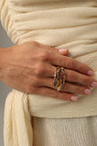 Claw Ring on model — handmade brass statement ring worn on finger showing wide wraparound scale and proportion
