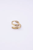  Glade handmade gold-plated brass wrap ring with organic texture and clear baguette-cut crystal on a white background