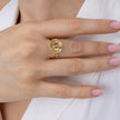 Posy Ring detail — handmade brass ring with open adjustable band and ruffled floral silhouette