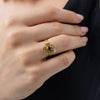 Posy Ring on model — handmade brass flower ring worn on finger showing scale and proportion
