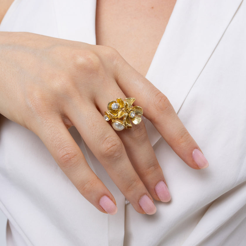Rosebud Ring — handmade brass floral cluster ring with pearl and crystal stones on model