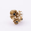 Rosebud Ring close-up — handmade brass ring with pearl and crystal stone detail set into petal clusters