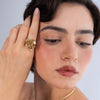 Rosebud Ring detail — handmade brass ring with textured petal layers and pearl and crystal setting