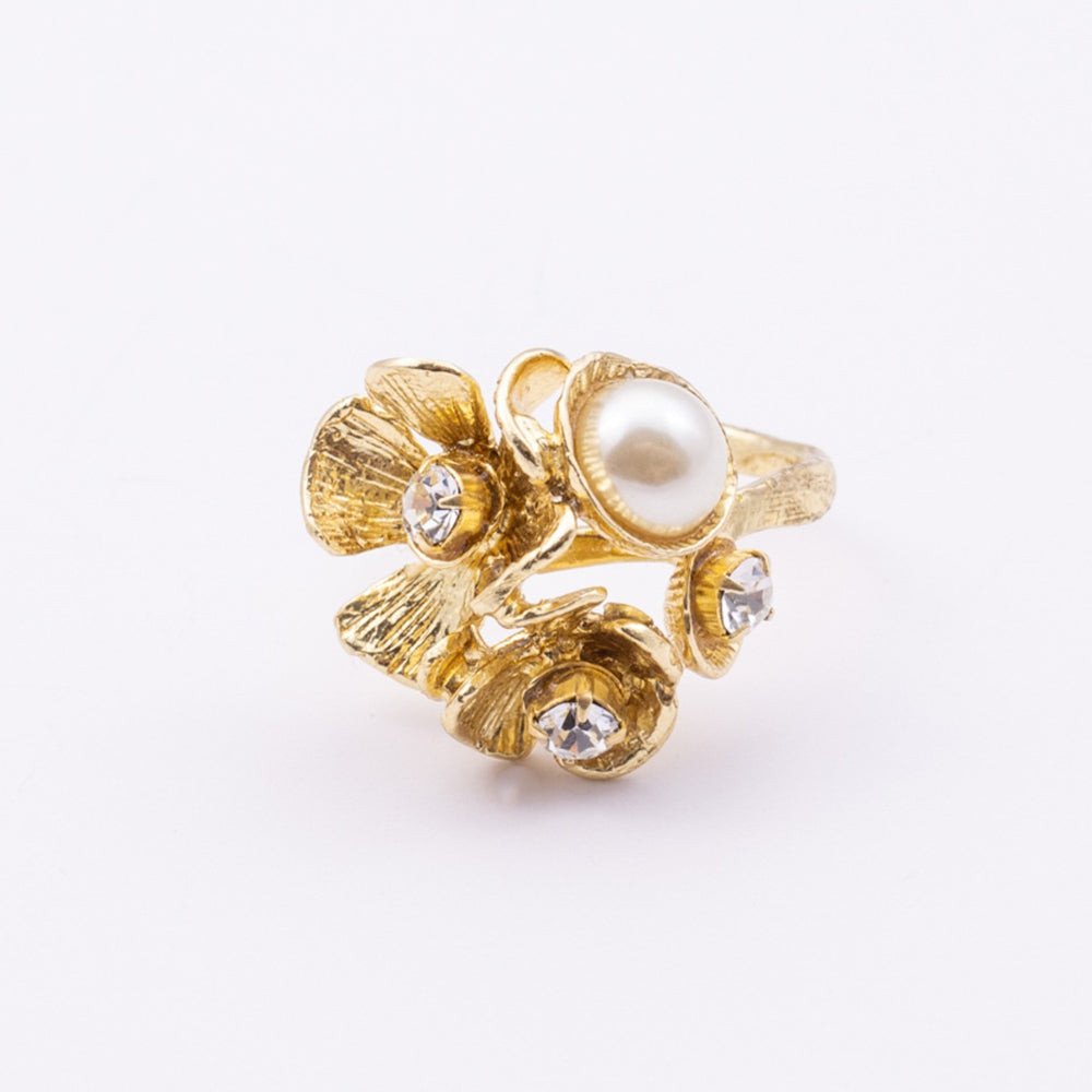 Rosebud Ring detail — handmade brass ring with textured petal layers and pearl and crystal setting whitebox
