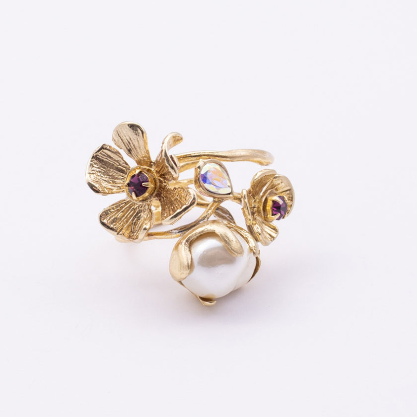 Bouquet Ring close-up — handmade brass ring with faceted crystal stone set into ridged petal center