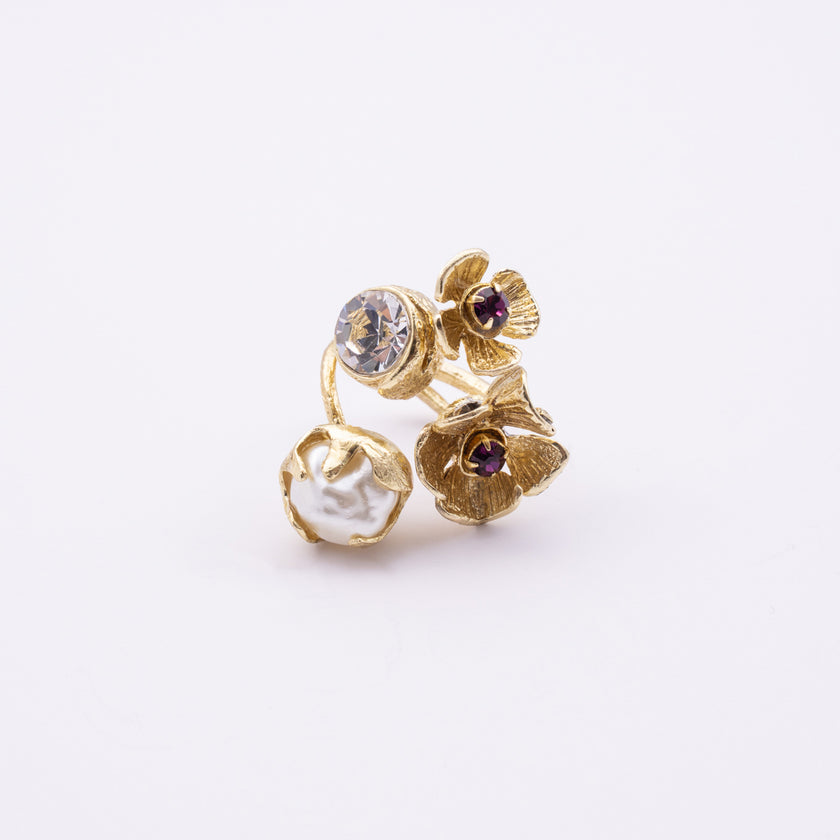 Double Posy Ring — handmade brass floral ring with crystal stone, pearl, and flower detail on white background