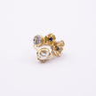Double Posy Ring side view — handmade brass open ring with paired flowers and faceted crystal stone