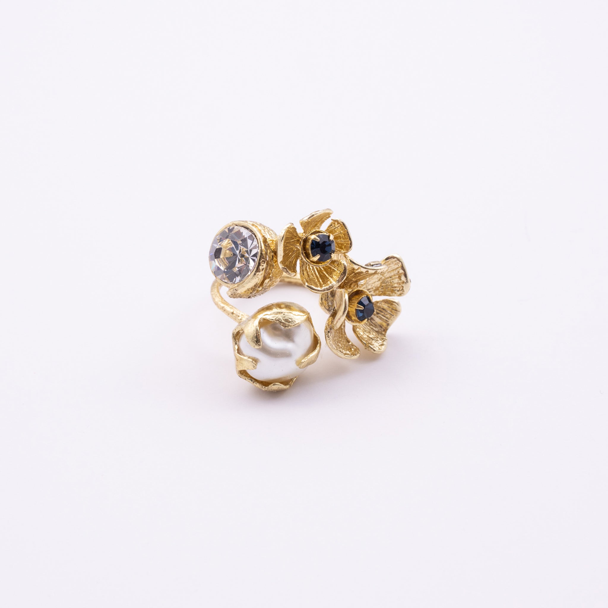 Double Posy Ring side view — handmade brass open ring with paired flowers and faceted crystal stone