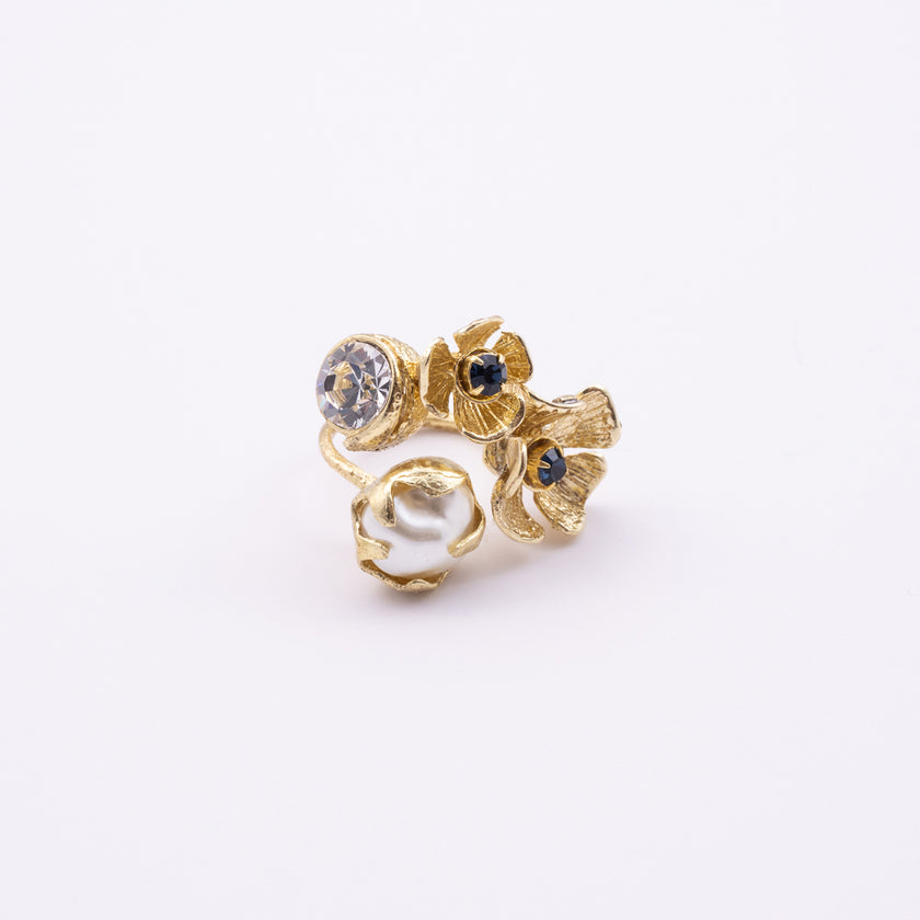 Double Posy Ring side view — handmade brass open ring with paired flowers and faceted crystal stone