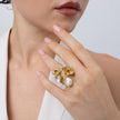 Double Posy Ring on model — handmade brass statement ring worn on finger showing scale and proportion
