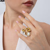 Double Posy Ring on model — handmade brass statement ring worn on finger showing scale and proportion