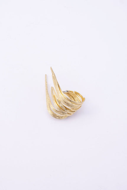 Pine handmade gold-plated wrap ring with textured pine-needle bands on a white background