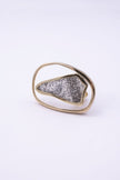 Angled view of sculptural open frame crystal ring, Glitter Kiss collection