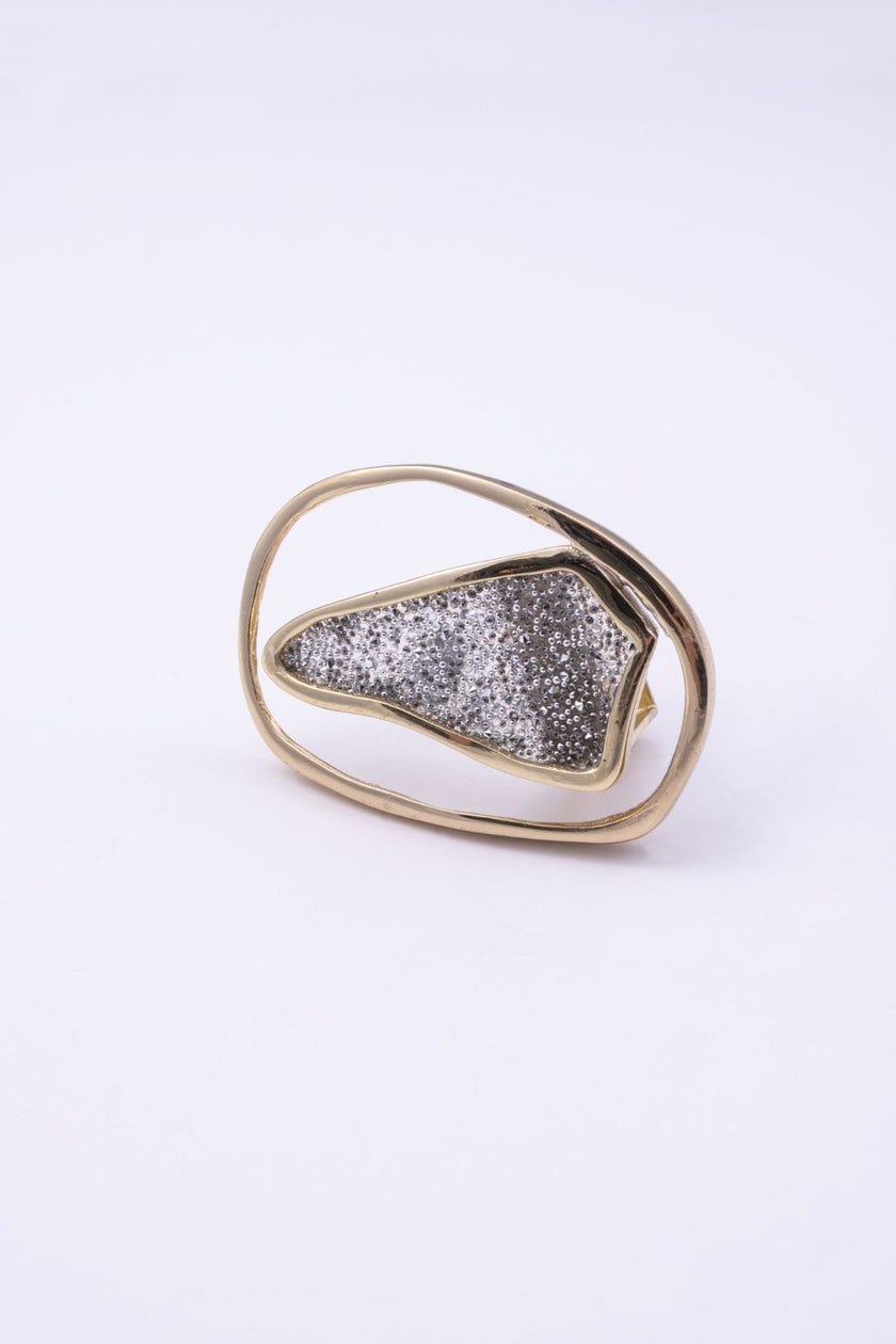 Angled view of sculptural open frame crystal ring, Glitter Kiss collection