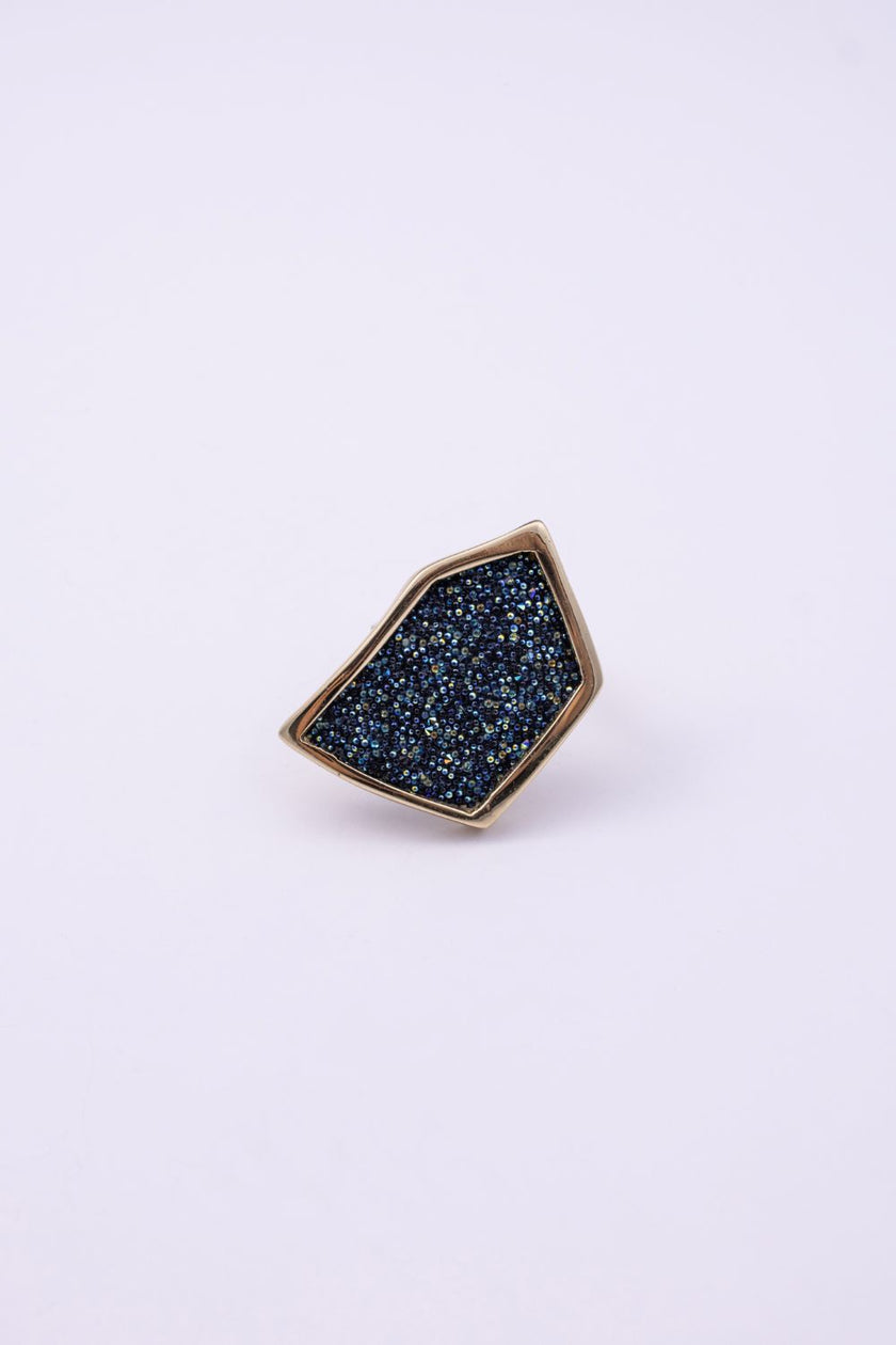 Front view of handmade gold geometric ring with compressed crystal surface