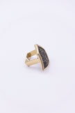 Angled view of sculptural geometric crystal ring with open back
