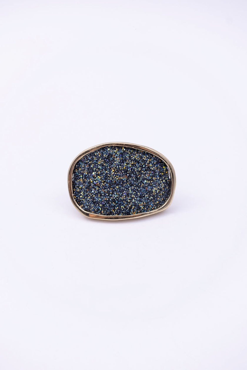 Front view of oval crystal ring with slim gold frame, handmade in Greece