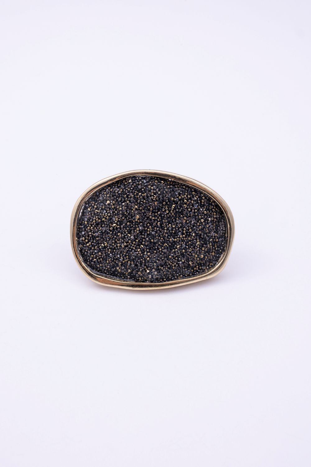 Top view of large oval crystal ring with compressed crystal surface