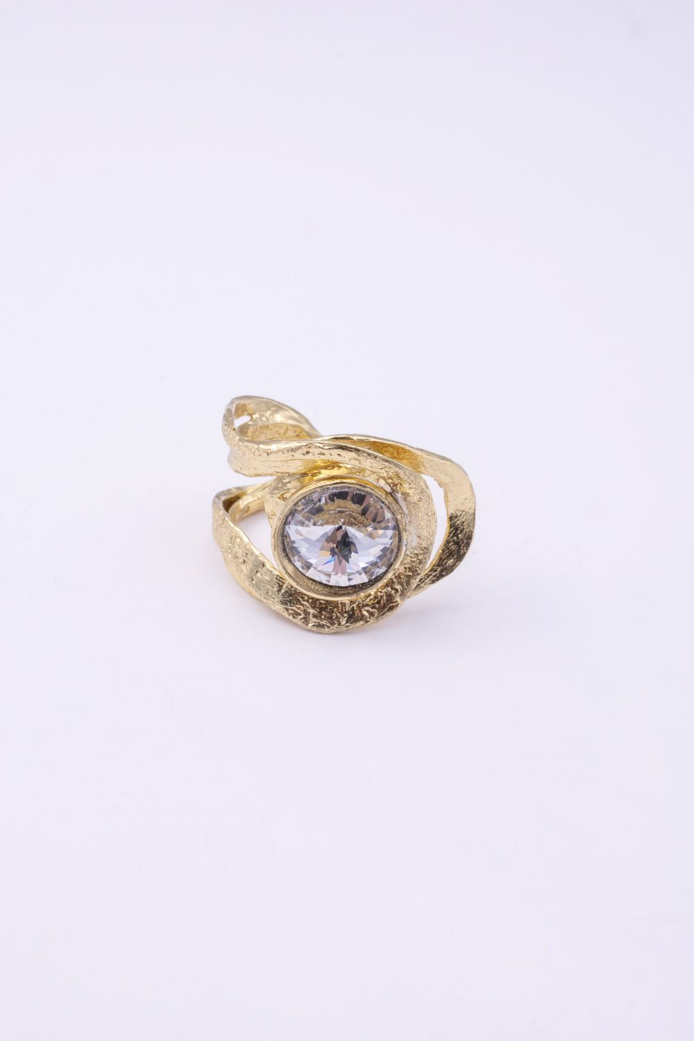 Shiny Boteh handmade gold-plated paisley statement ring with clear crystal and textured bands on a white background
