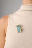 Crabby Pin detail — handmade brass artisan brooch with organic marine motif and resin stone