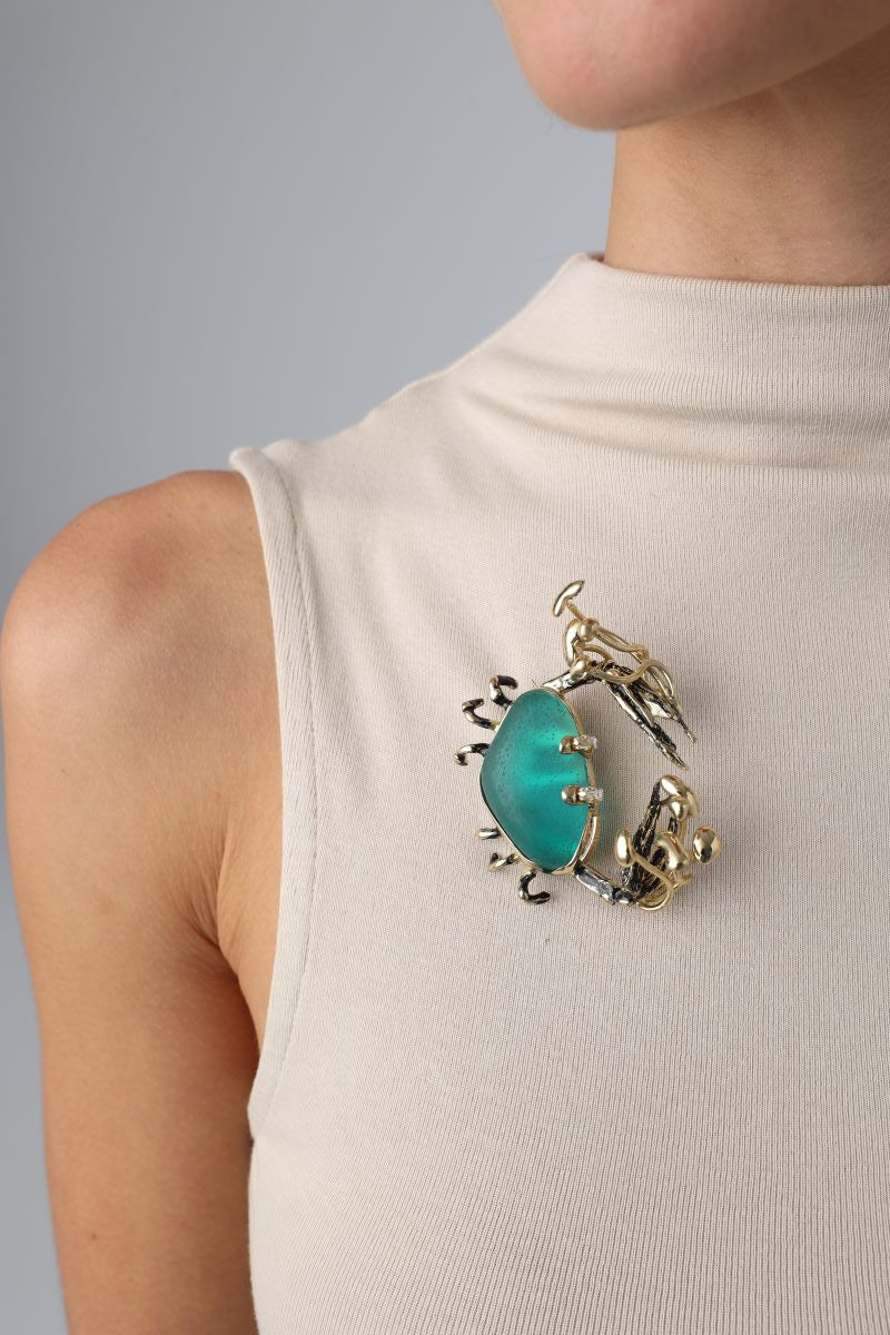 Claw Crabby Pin on model — handmade brass statement crab pin worn on a beige top