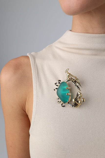 Claw Crabby Pin on model — handmade brass statement crab pin worn on a beige top