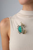 Claw Crabby Pin on model — handmade brass statement crab pin worn on a beige top