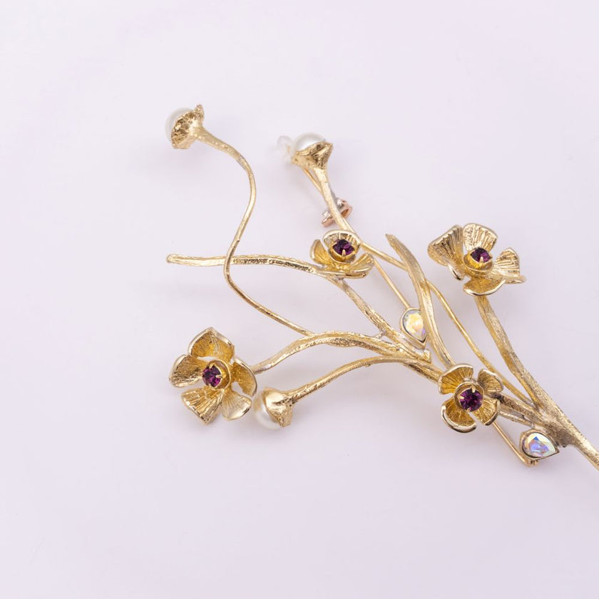 Brass floral brooch with pearl stems and crystal flowers, side angle